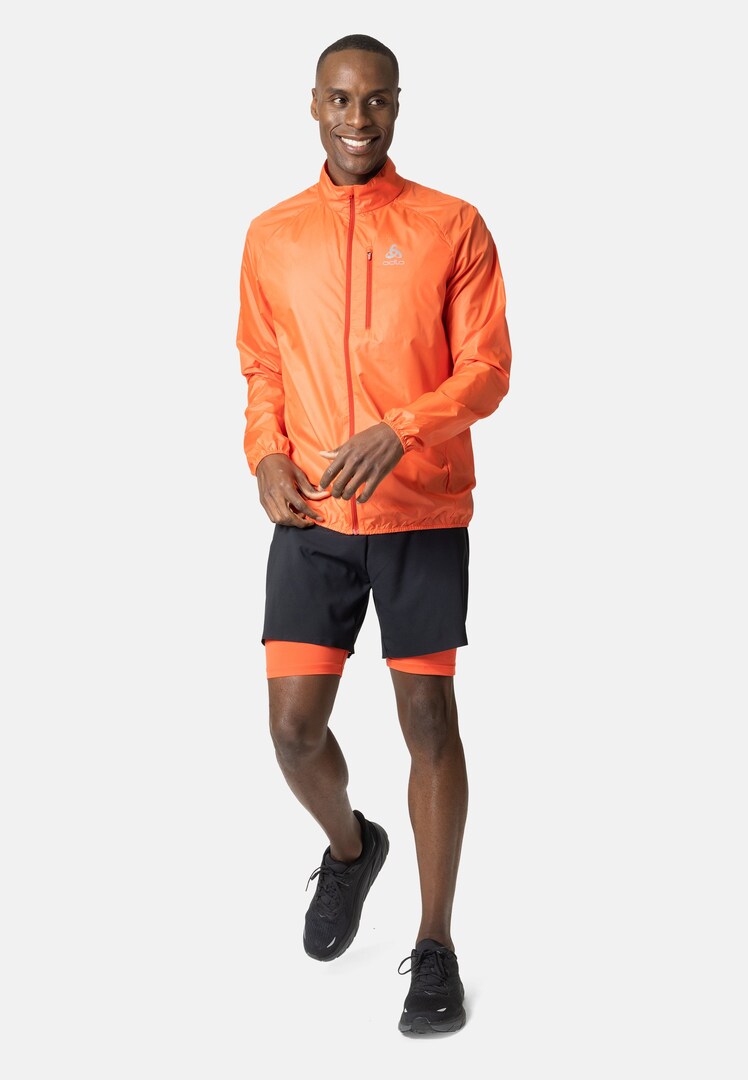 The Zeroweight running jacket in firelight | High